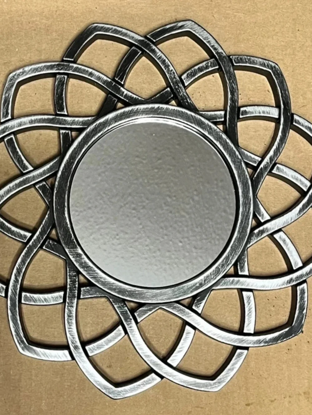 Silver tone antiqued mini mirror.